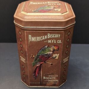 Vintage American Biscuit Tin,Brown With Parrot Design .